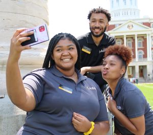 A group of three students posing for a selfie.