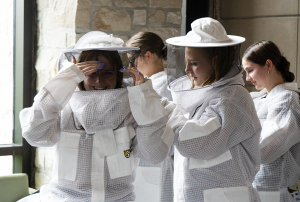 Students getting their beekeeping gear on.