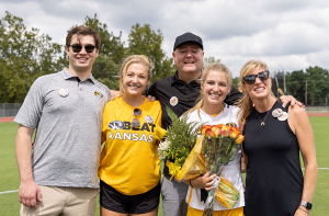 Caroline Lyman posing for a picture with her family.