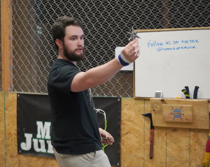 James Long showing how to hold and throw a throwing star.