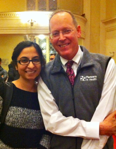 Kanwal Haq, pictured on the left, posing for a picture with Paul Farmer.