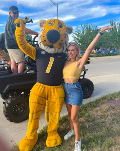 Kimberly Barr posing for a picture with Truman the Tiger.