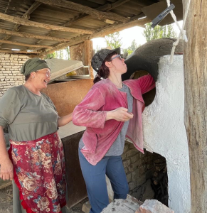 Lauren Pike cooking a meal with help from other individuals.