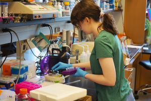 Margaret Beecher in a lab performing a research task.