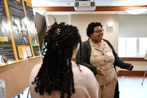 Two students sharing their research during a presentation.