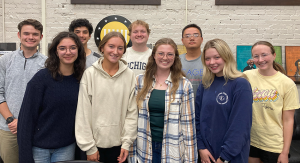 A group of students smiling at the camera for a picture.