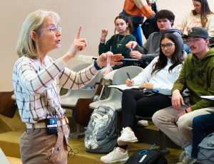 Shari Freyermuth teaching to a classroom full of students.