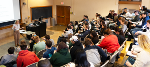 Shari Freyermuth teaching to a classroom full of students.