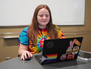 Willow Amann working on a laptop.