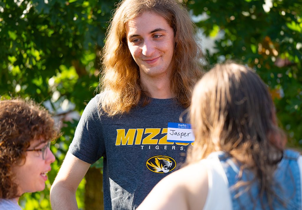 A group of students talking to each other.