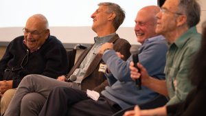 A group of individuals laughing together.