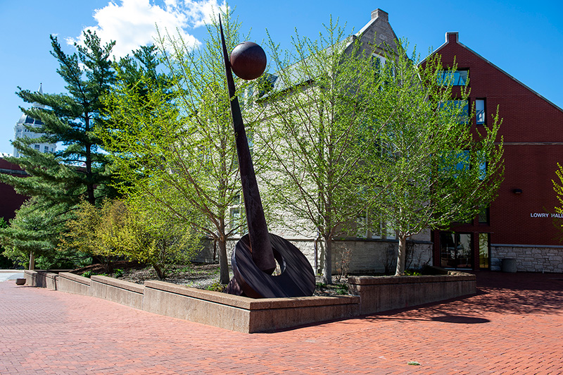 A picture of Lowry Hall on a sunny day, featuring a blue sky and green trees.