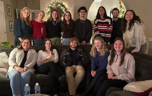 A group of students smiling while posing for a picture.