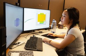 Thao Nguyen working on her computer on a research project.