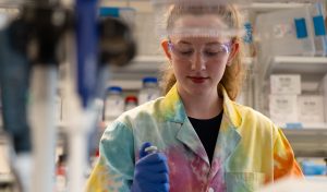 Ava Fleury conducting a research experiment in a laboratory.