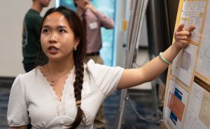 Thao Nguyen discussing her research during a poster presentation.
