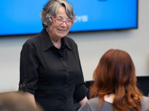 Anne Deaton talking to a student.