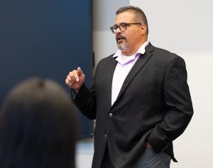 Jose Ramirez talking to a group of students.