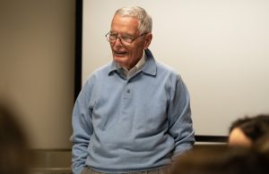 Gary Smith talking to a group of students.
