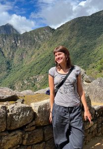 A student smiling while posing for a picture during a study abroad experience.