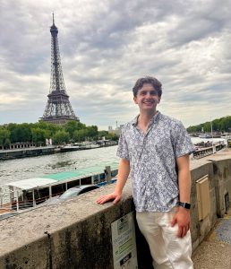 A student smiling while posing for a picture during a study abroad experience.