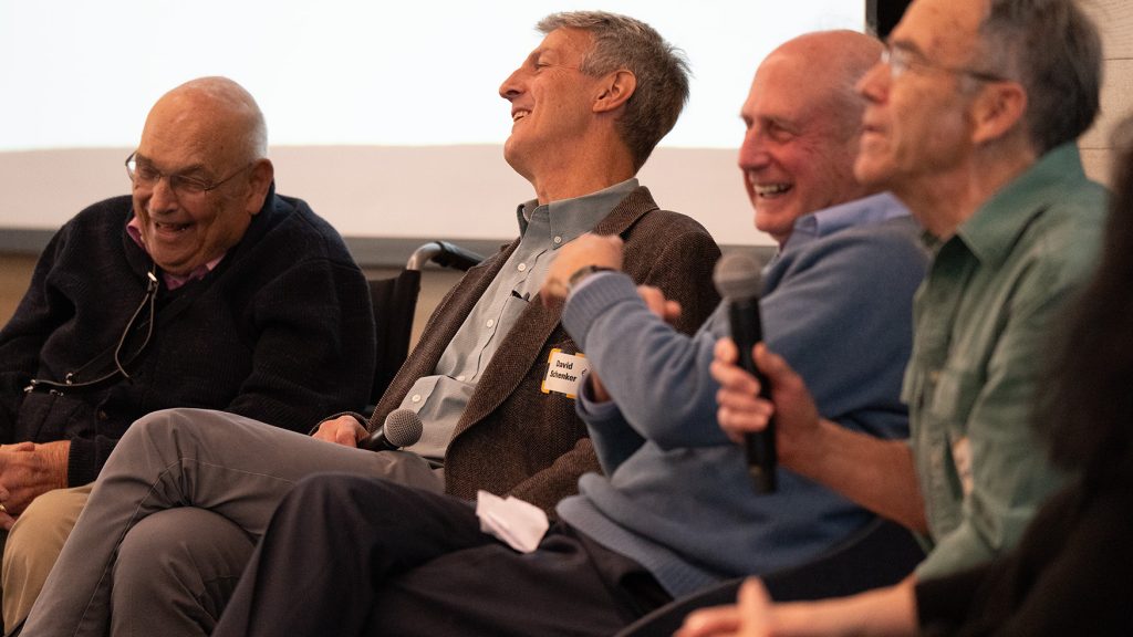 A group of individuals laughing.