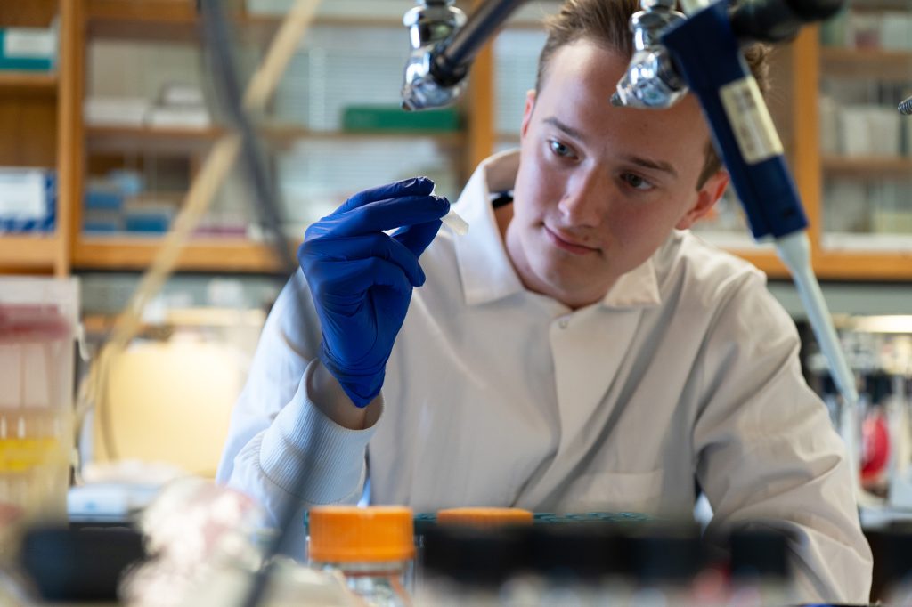 Noah Davis participating in a research task in a laboratory.