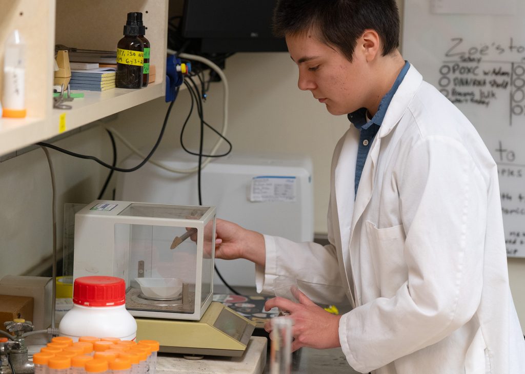 Adam Muellersman performing a research task in a research laboratory.