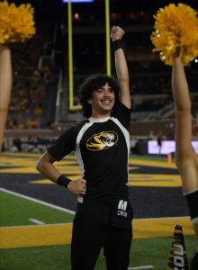 Izayah Christopher cheering during a football game.