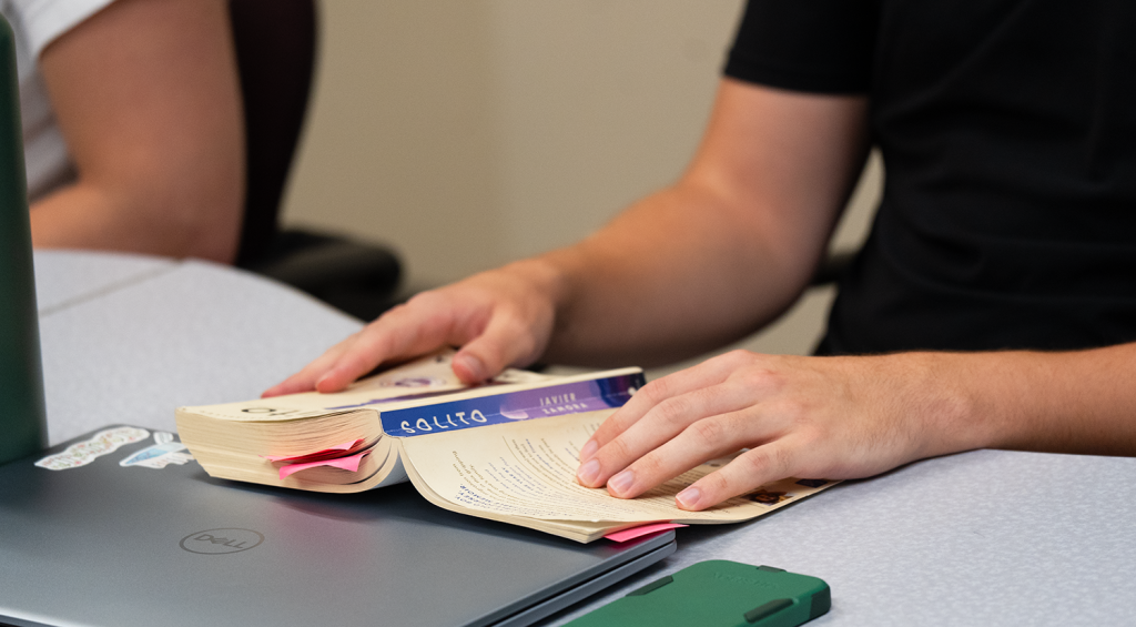 A picture of an individual holding the book "Solito."