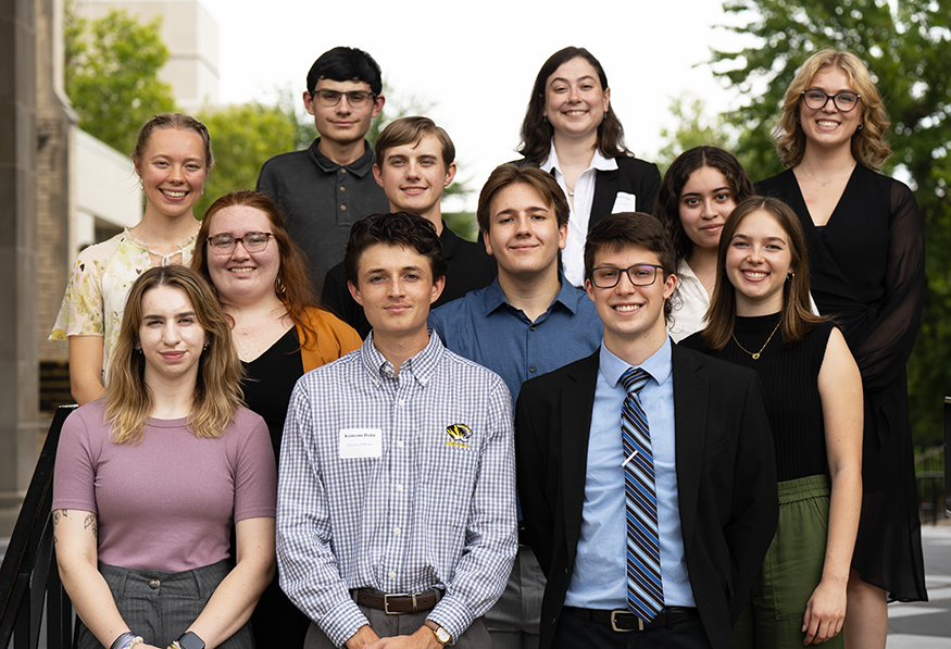 Students smiling for a group photo.