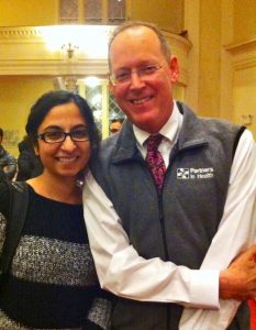 Kanwal Haq posing for a picture with Paul Farmer.