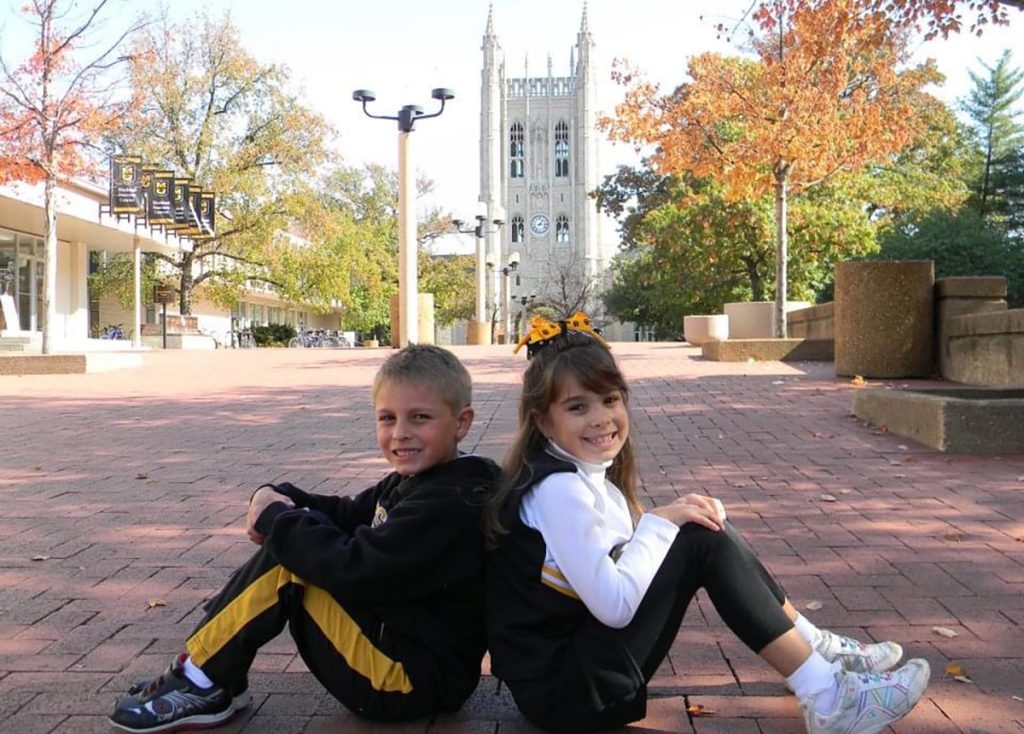 Madison Hayes and her brother posing for a picture on the Mizzou campus when they were younger.