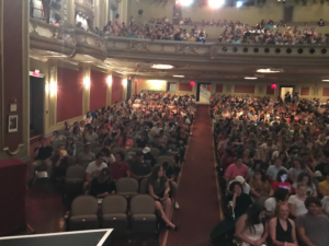 MU Honors College student sit in the Missouri Theatre.