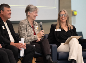 Susan Duncan and Catherine Rymph laughing while Duncan talks.